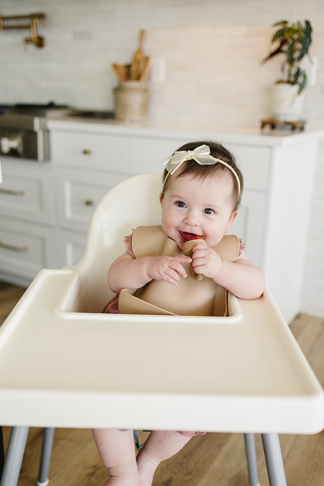 baby using pacifier fruit feeder 