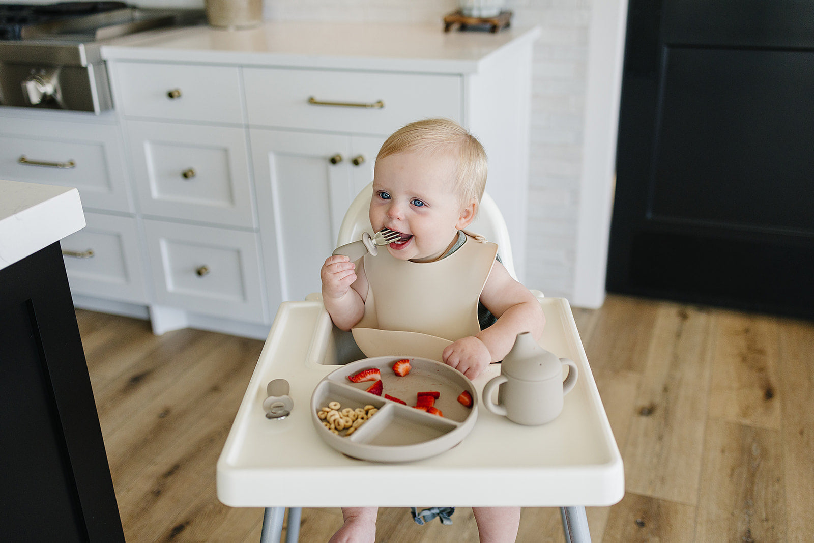 toddler eating with food-grade silicone bib