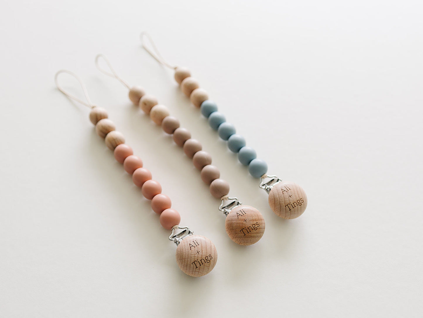 neutral color silicone and wood pacifier clip for babies