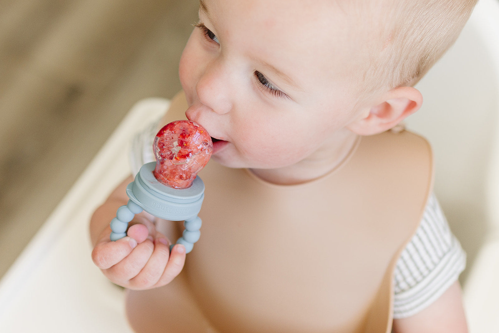 silicone baby food feeder filled with frozen puree